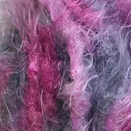 Ball of pink and gray yarn with a barcode label on a white background