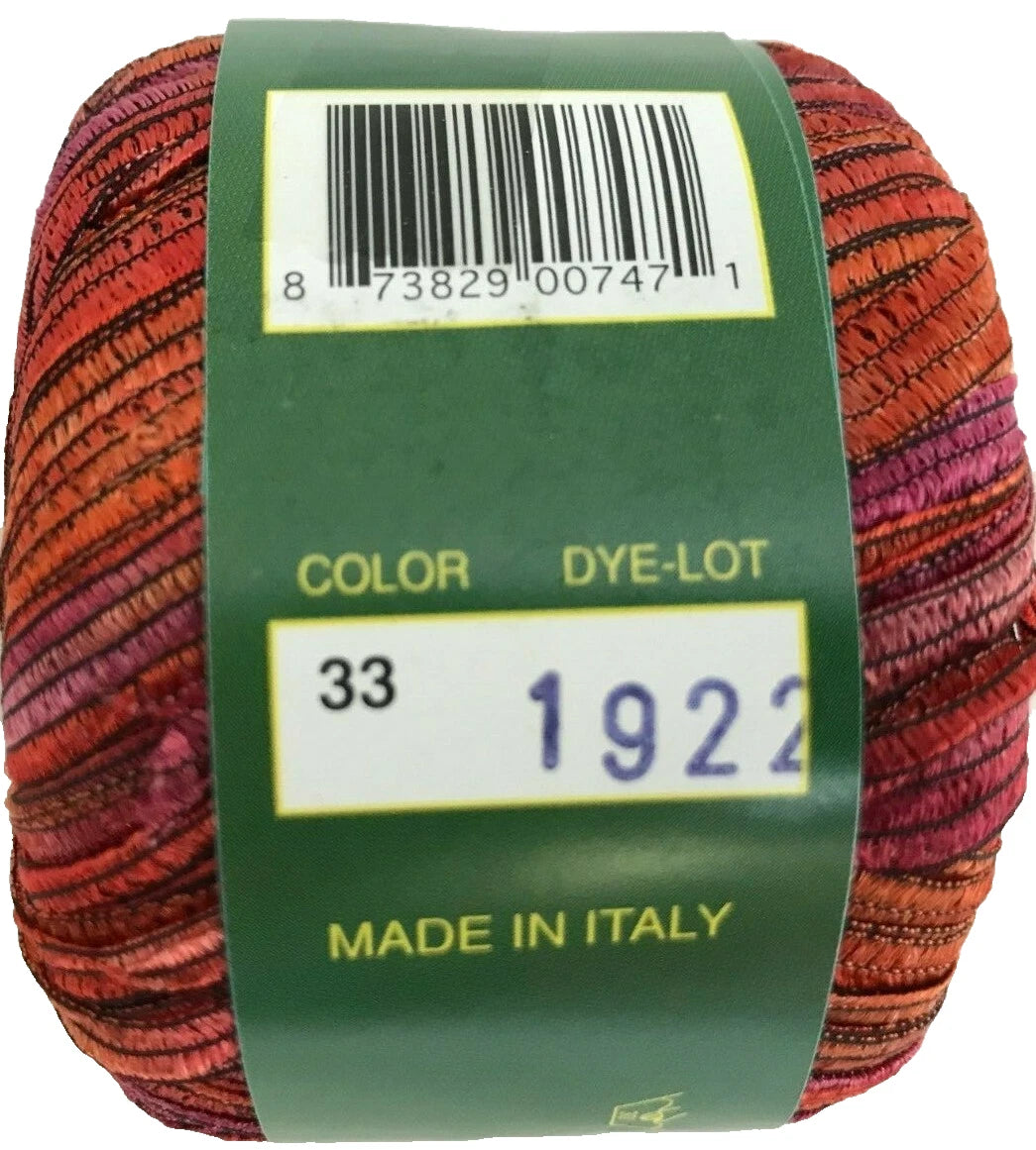 Multicolored yarn ball with a green label displaying a barcode, color code, and 'Made in Italy' text.