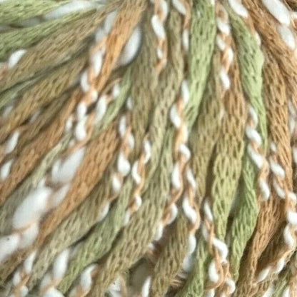 Close-up of green, brown, and white braided yarn.