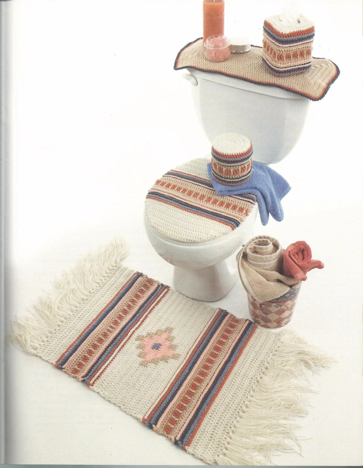 Bathroom set with toilet cover, bath mat, and decorative items on a white background