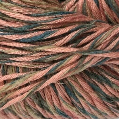 Ball of yarn with a Tahki Yarns label on a white background