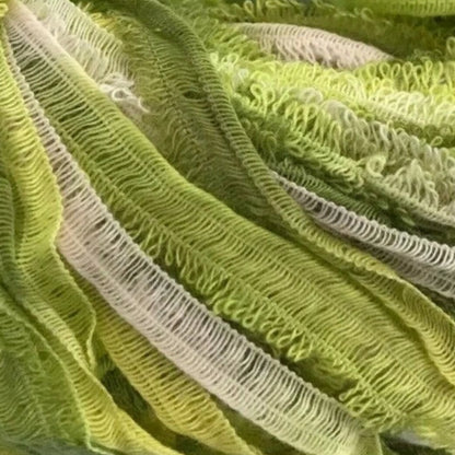 Green skein of yarn with a label on a white background