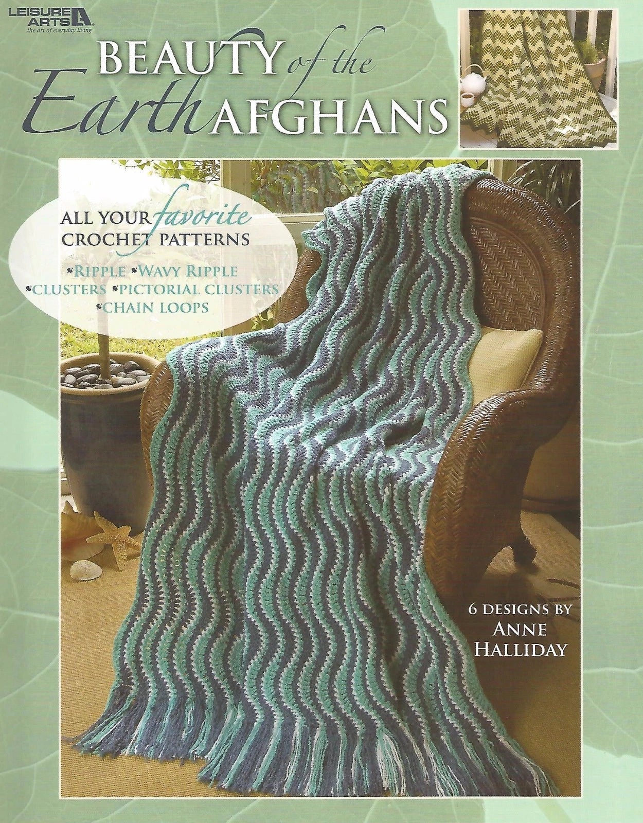 Book cover of 'Beauty of the Earth Afghans' with a crocheted blanket on a chair.