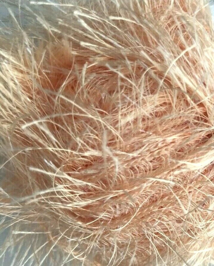 Close-up of pink hair strands on a blurred background