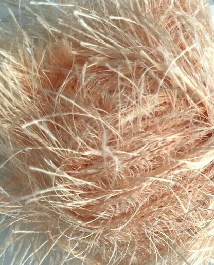 Close-up of pink hair strands on a blurred background