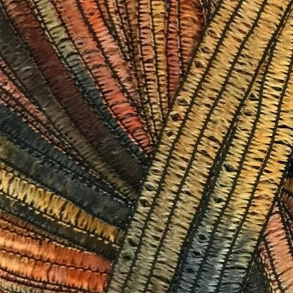 Close-up of textured fabric with wavy pattern in earthy tones