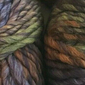 Close-up of two skeins of multicolored yarn.