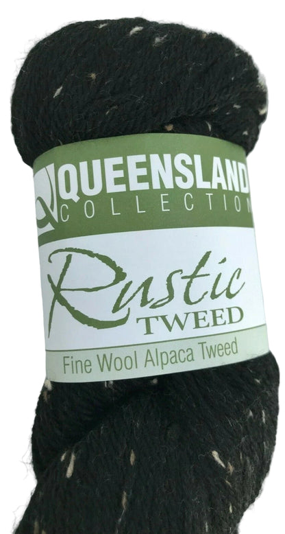 Black yarn skein with a green label on a white background