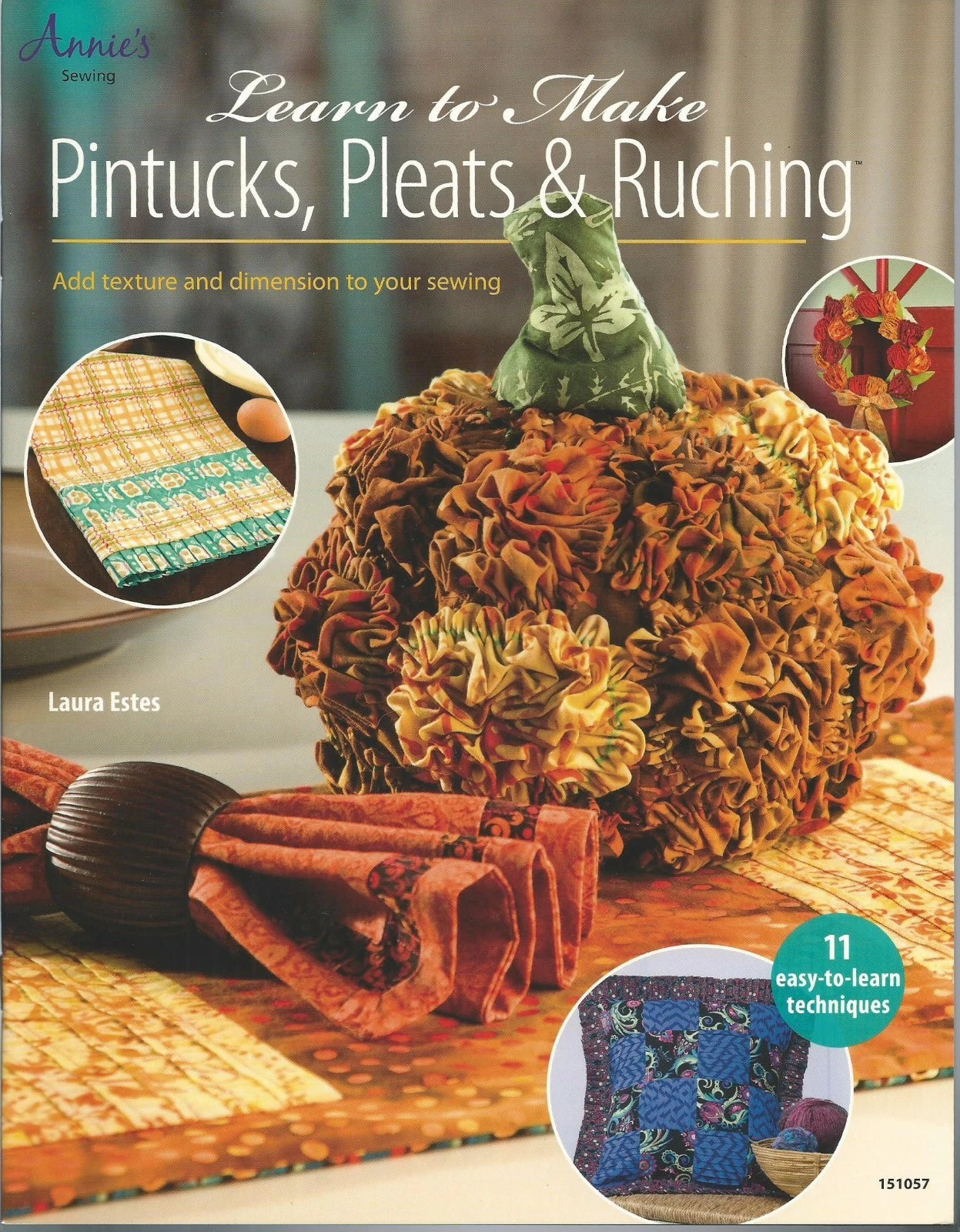 Book cover of 'Learn to Make Pintucks, Pleats & Ruching' with a pumpkin decoration and fabric samples.