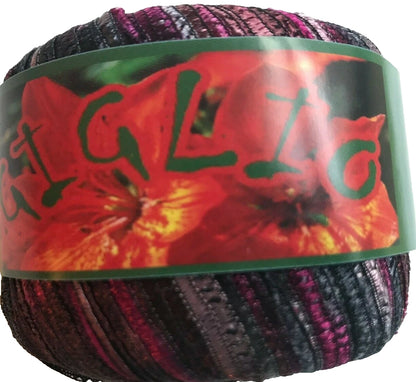Multicolored yarn ball with a floral label on a white background