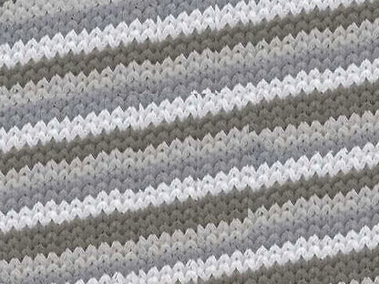 Close-up of a textured fabric with wavy pattern in gray and white.