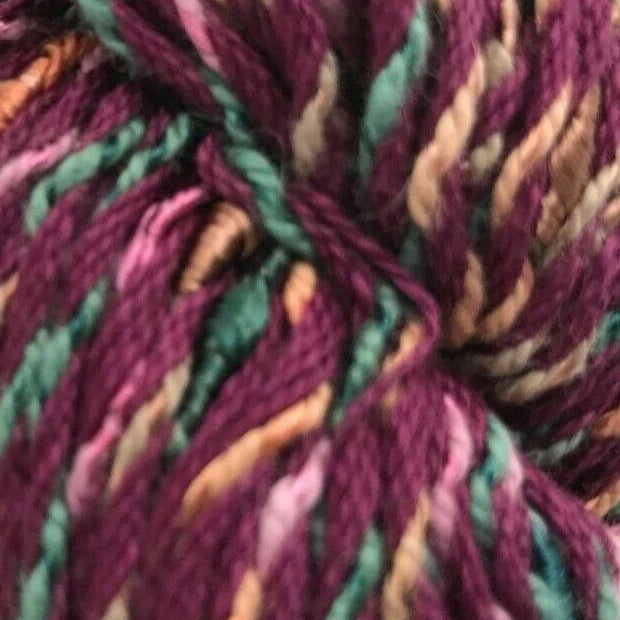 Multicolored skein of yarn on a white background