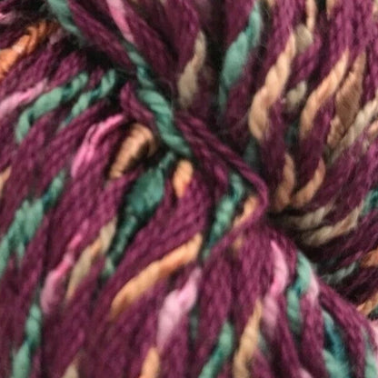 Multicolored skein of yarn on a white background