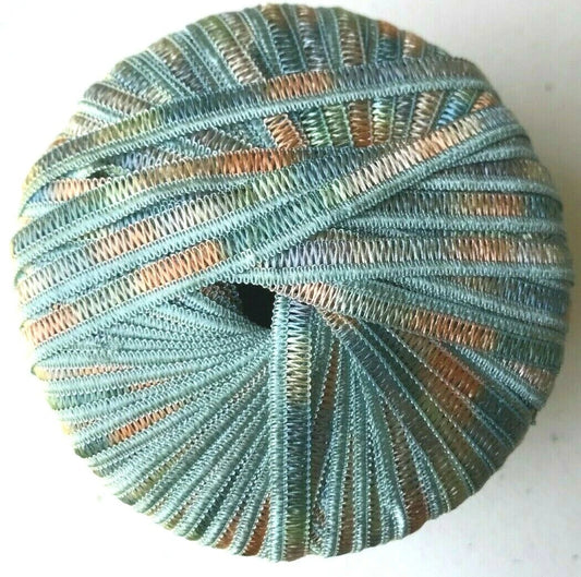 Spool of blue and green yarn on a white background