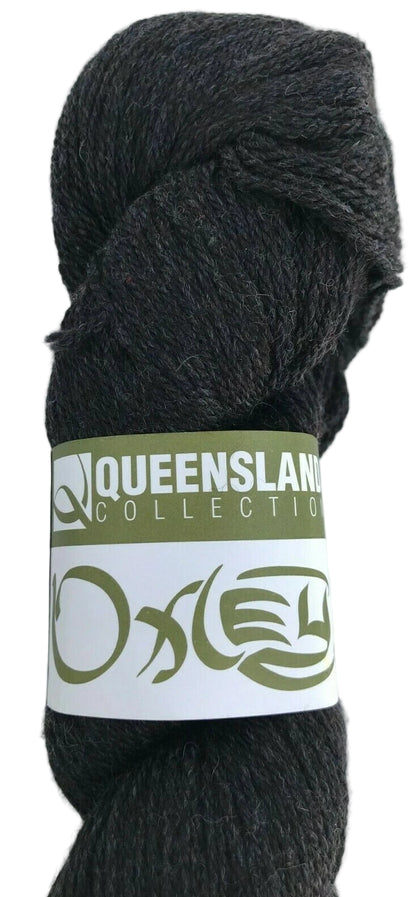 Dark gray skein of yarn with a label on a white background