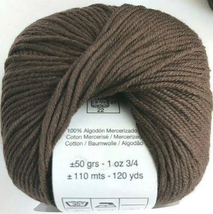 Ball of brown yarn with label on a white background
