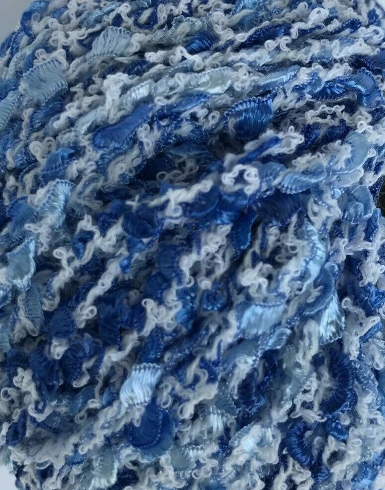Close-up of blue and white textured yarn ball