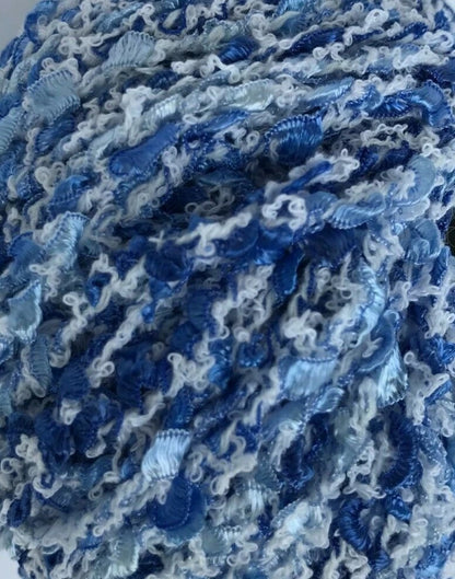 Close-up of blue and white textured yarn ball