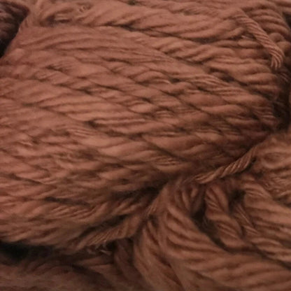 Brown yarn ball with label on a white background