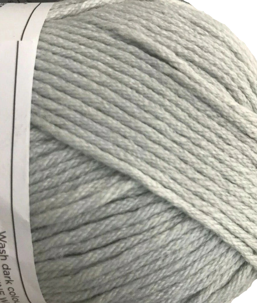 Close-up of light gray yarn with a label on a white background