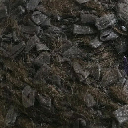 Close-up of textured dark brown fabric with a shaggy finish