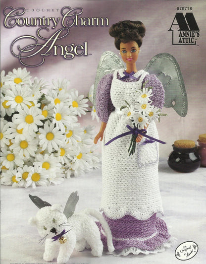 Crocheted angel doll with wings and a rabbit, surrounded by flowers, on Annie's Attic packaging.