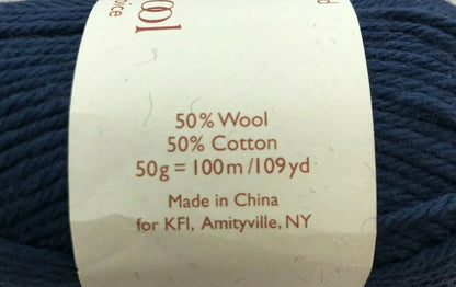 Yarn label with details on a ball of blue yarn