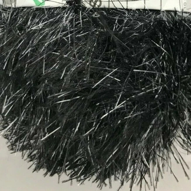 Close-up of black tinsel on a white background