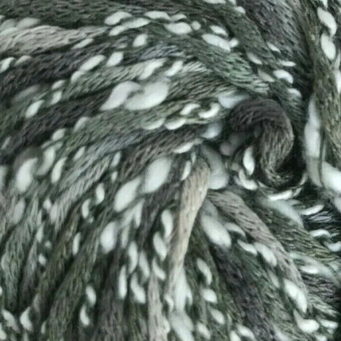 Ball of gray and white yarn on a white background