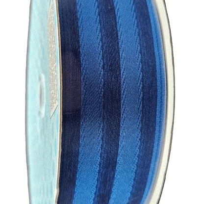 Glass vase with blue and white striped pattern on a white background