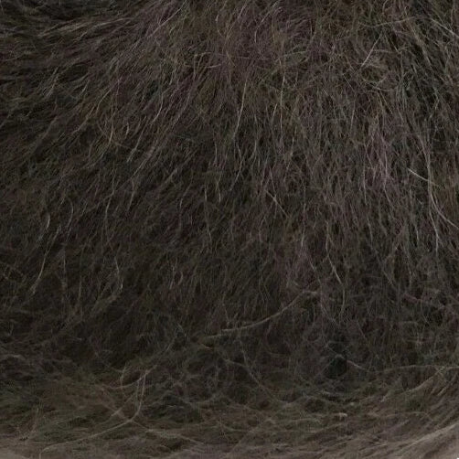Brown yarn ball with a label on a white background