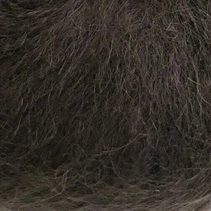 Brown yarn ball with a label on a white background