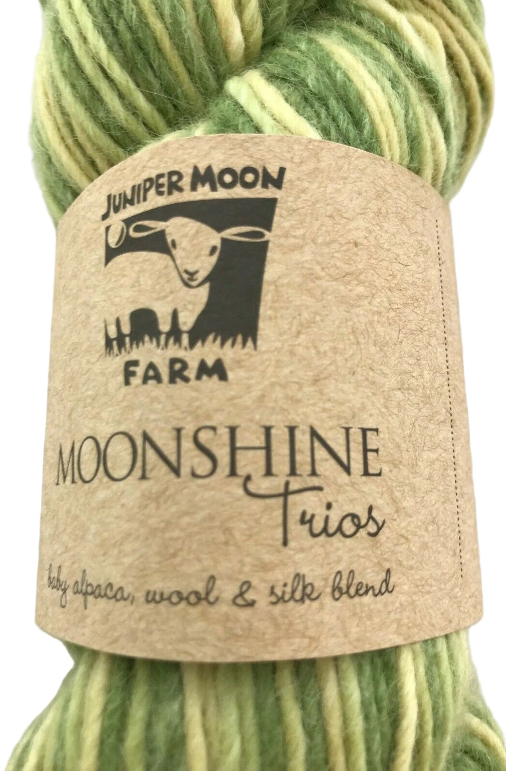 Green yarn skein with 'Juniper Moon Farm Moonshine Trios' label on a light background