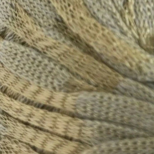 Close-up of a skein of yarn with brown and beige colors.