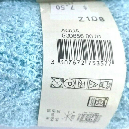 Two balls of light blue yarn with labels on a white background