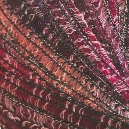 Close-up of textured fabric with wavy pattern in red and black