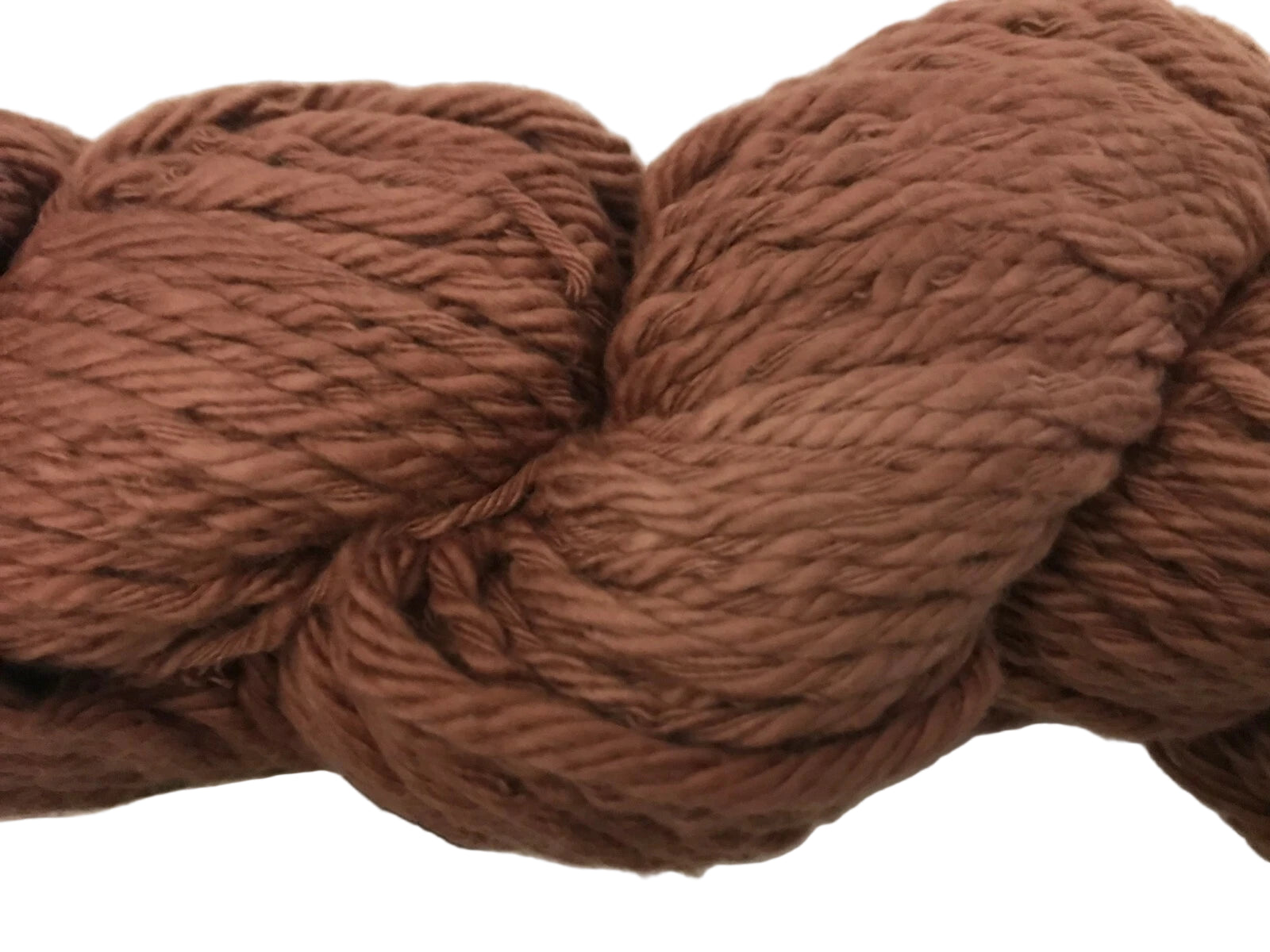 Brown yarn ball with label on a white background