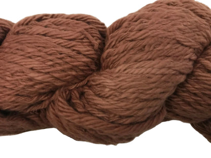 Brown yarn ball with label on a white background