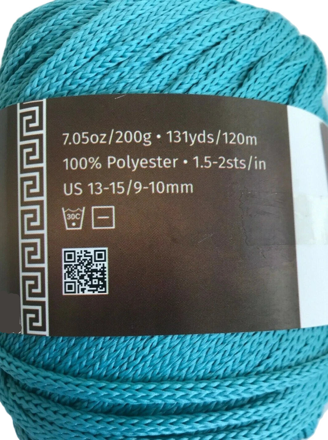 Turquoise yarn with label on a white background