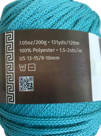 Turquoise yarn with label on a white background
