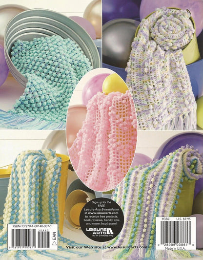 Back cover of a Leisure Arts craft book with yarn and knitting projects.