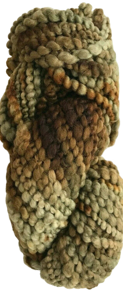 Knitted yarn skein in green and brown tones on a white background