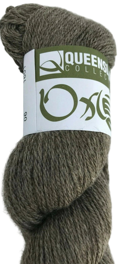 Ball of yarn with a 'Queensland College' label on a white background