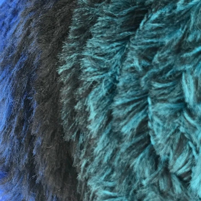 Close-up of a blue and green textured fabric