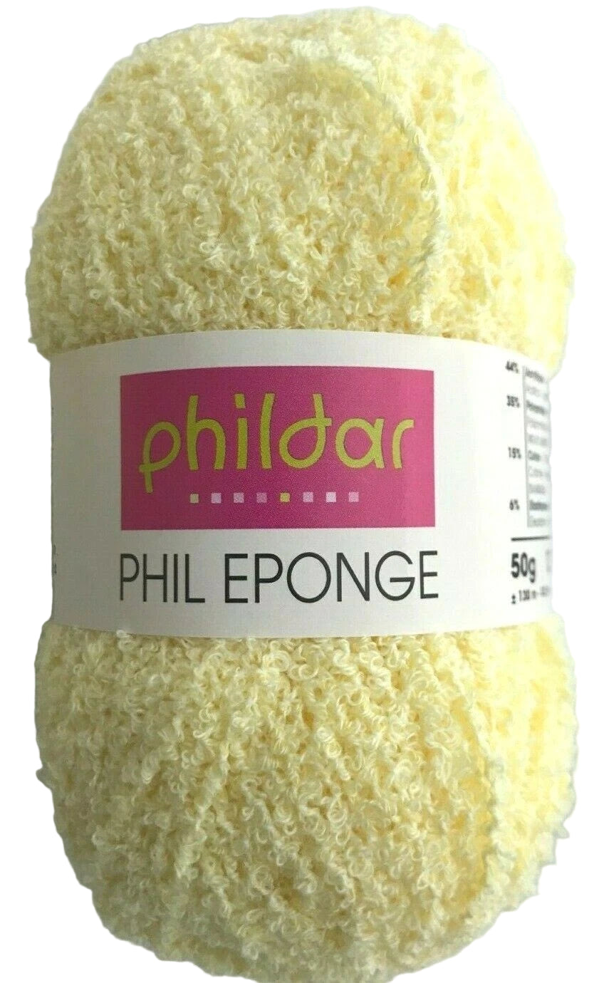 Yellow sponge with Phildar label on a white background