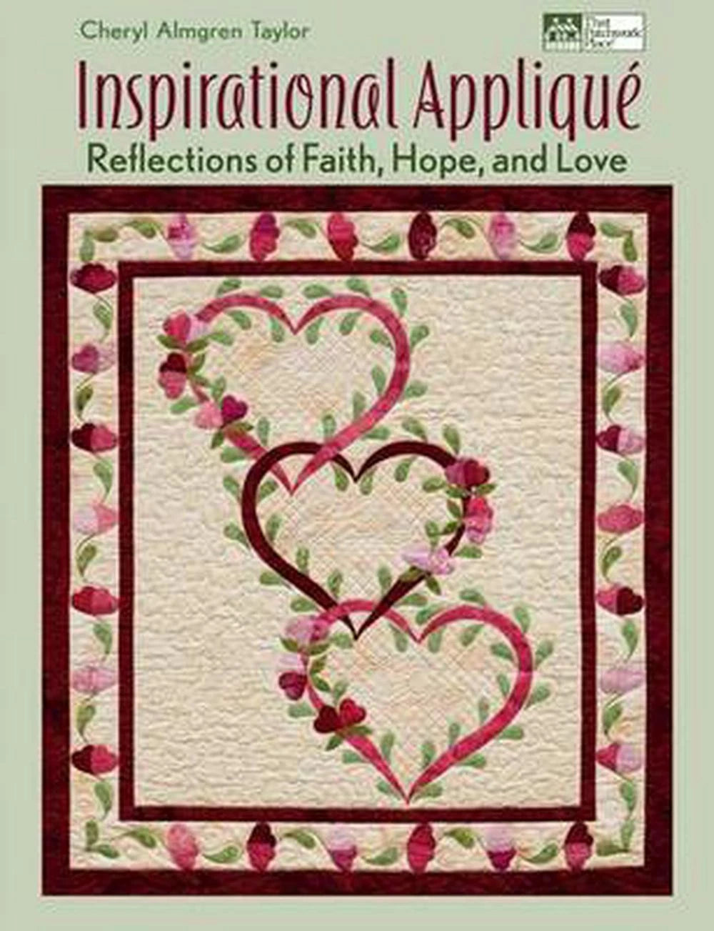 Book cover of 'Inspirational Applique' with a quilt design featuring hearts and flowers on a green background.