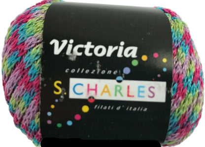 Multicolored yarn ball with 'Victoria' and 'S. Charles' label on a white background