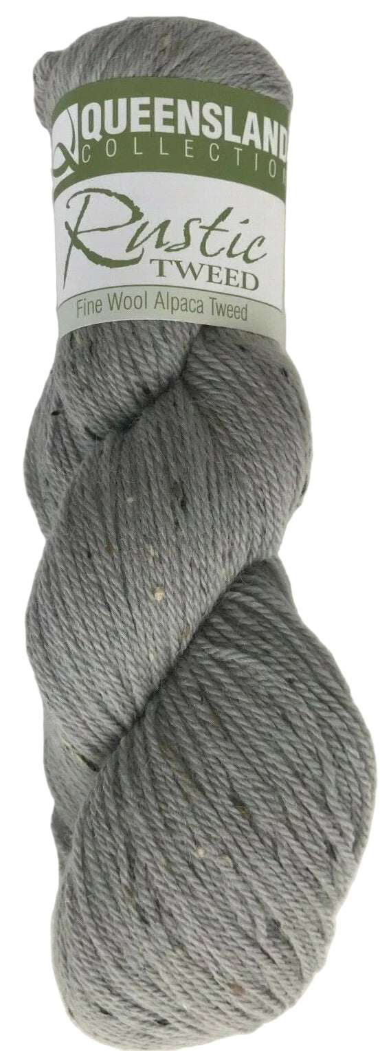 Gray skein of yarn with a Queensland Collection label on a white background