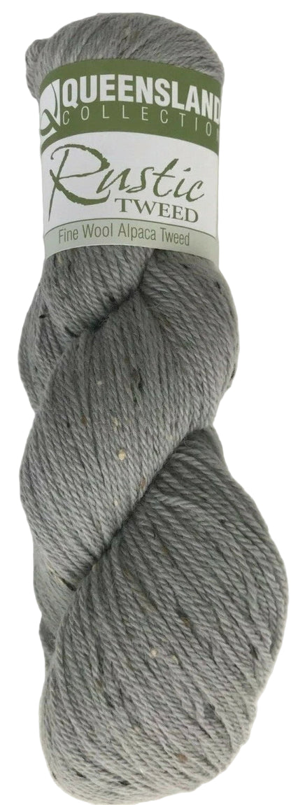 Gray skein of yarn with a Queensland Collection label on a white background