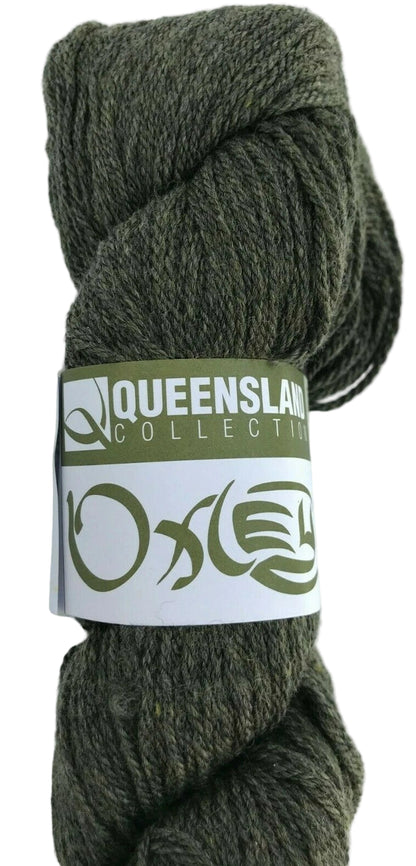 Ball of green yarn with a label on a white background